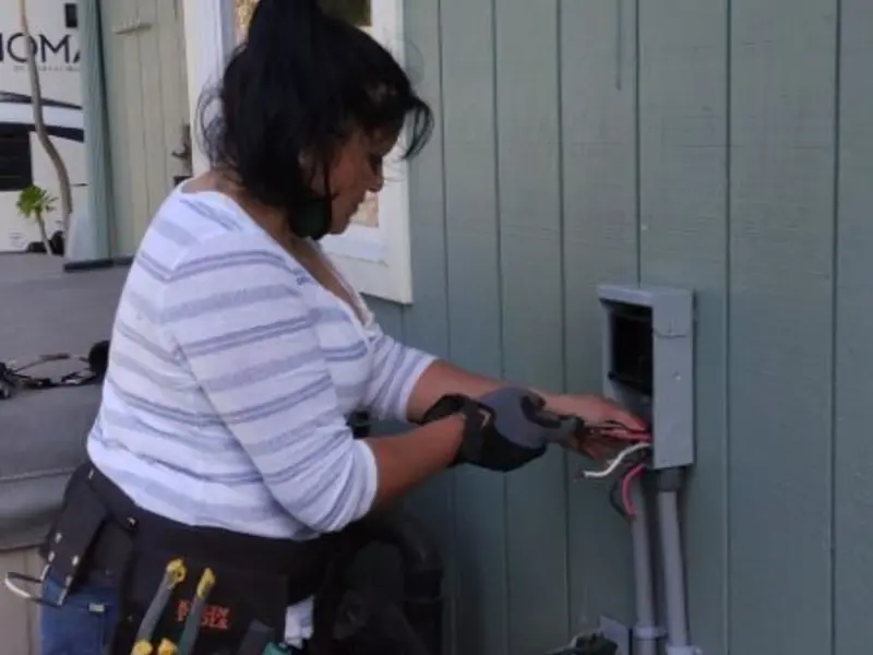 Licensed electrician wiring an exterior subpanel in River Grove
