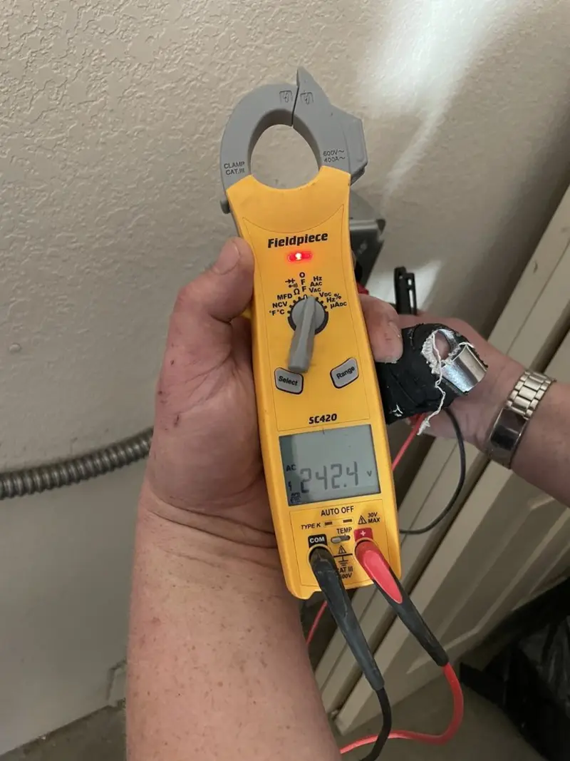 Voltage testing with clamp meter during Ceiling Fan Installation in River Grove